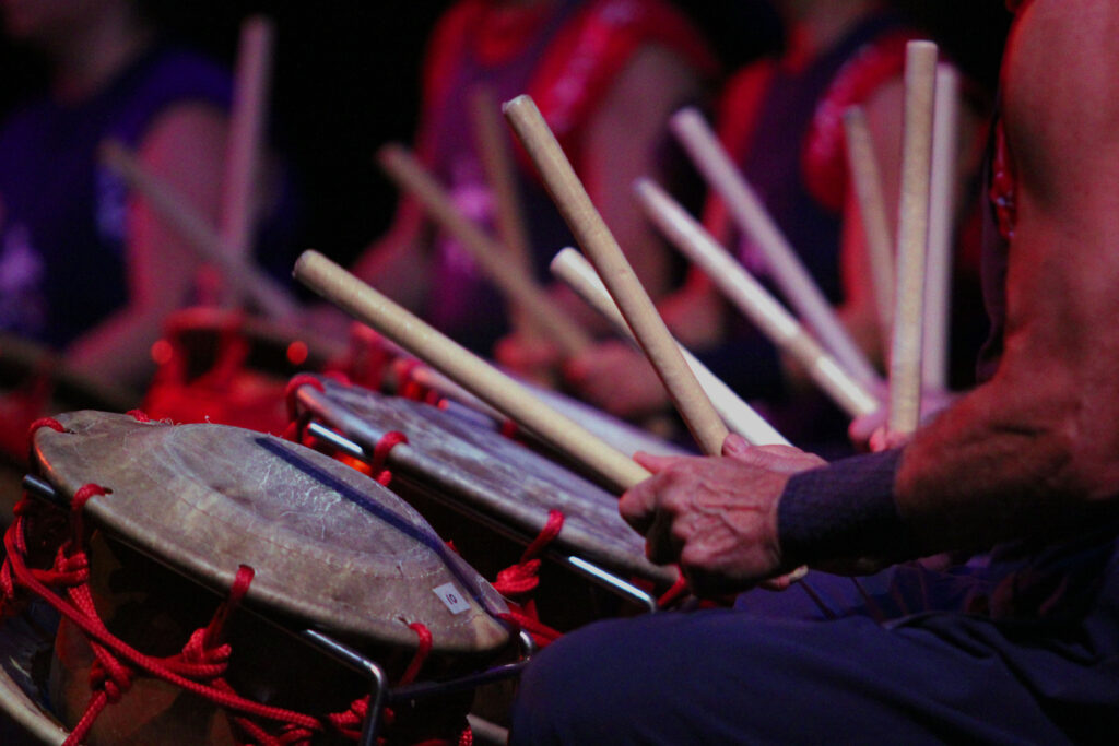 A closeup shot of a drum and drumsticks during a Burlington Taiko Group performance.